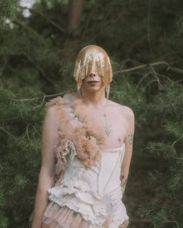 A person in costume posing at the Whole festival Berlin