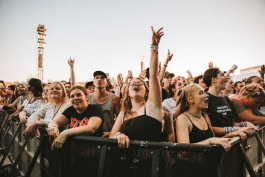 Crowd screams at a musical performance at the LOLLAPALOOZA festival in Berlin