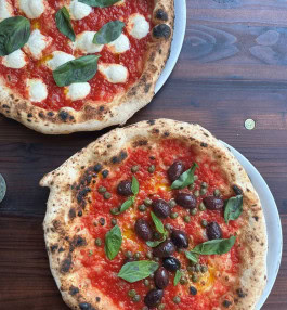 Two vegan pizzas at La Stella Nera, Berlin