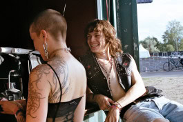 Two persons chilling at the Whole festival Berlin