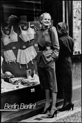 Photo of woman smiling near a lingerie store window, Berlin