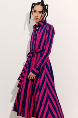 Model posing in Maqu K dress