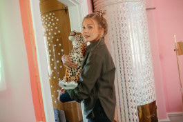 Woman holding a leopard figurine 