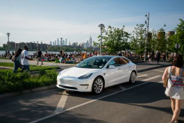 Tesla on a busy street 