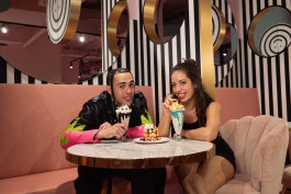 Man and women are drinking cocktails in the Upside Down Berlin