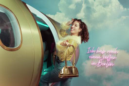 Women is posing in the Upside Down Berlin