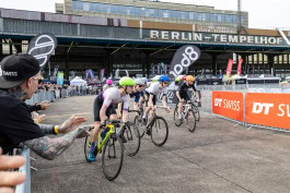 People ride bicycles along the track at a Velo Berlin competition 