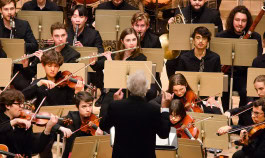 Photo of the Boston Youth Philarmonic Orchestra performing with Maestro Benjamin Zander 