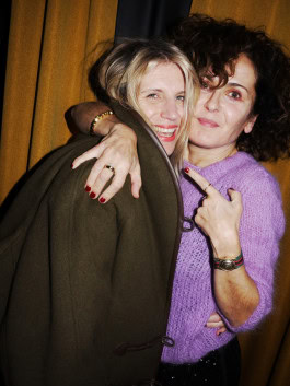 Antje Wewer and Marie Lou Sellem embrace at Sicilia Dinner