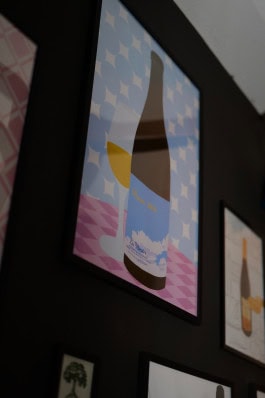 Poster with a bottle of wine and a glass at the Blanc de Fck bar in Berlin