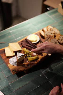 Wine snack board (cheeses, croutons, cucumbers) at Blanc de Fck bar in Berlin