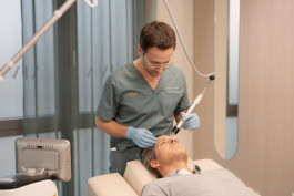 Doctor performs beauty treatments on a man at AIVA