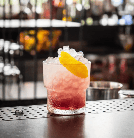 Monkey Bar photo of a drink with ice and a slice of lemon